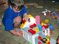 Absorbed in a Playmobil house